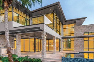 Modern style home with Marvin Signature Coastline Casement Awning and Picture Windows and Marvin Signature Coastline Multi-Slide Door